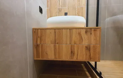 Cabinet in the bathroom. Hanging bedside table under the washbasin